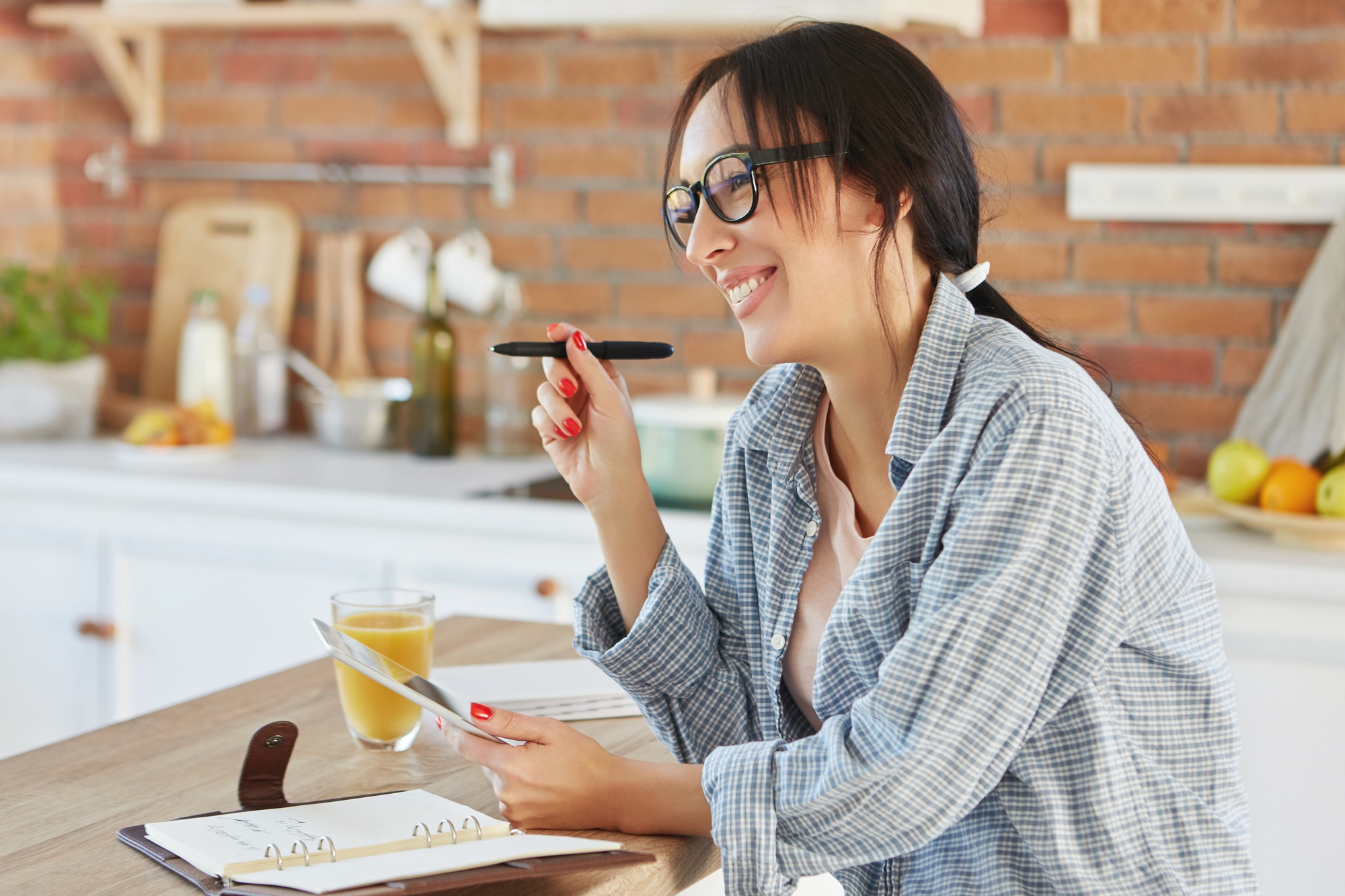 Young female dietitian or nutritionist has happy expression, being glad to create new effective diet